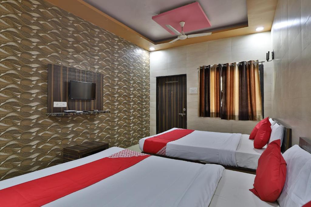En eller flere senge i et værelse på Hotel Star Villa