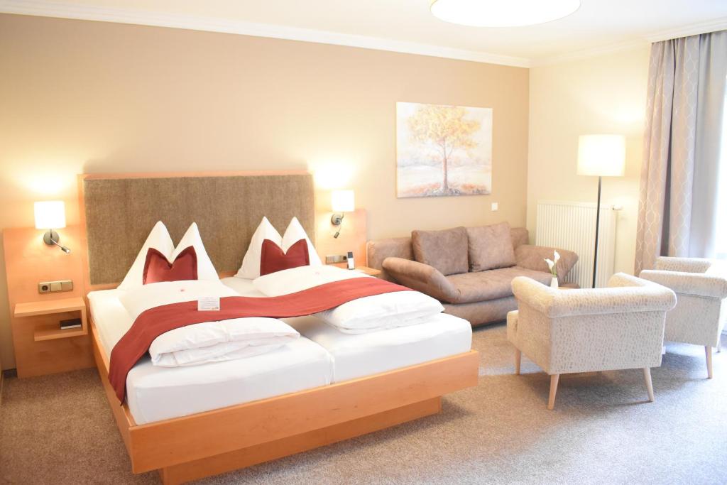 Voodi või voodid majutusasutuse Gartenhotel Kloepferkeller toas