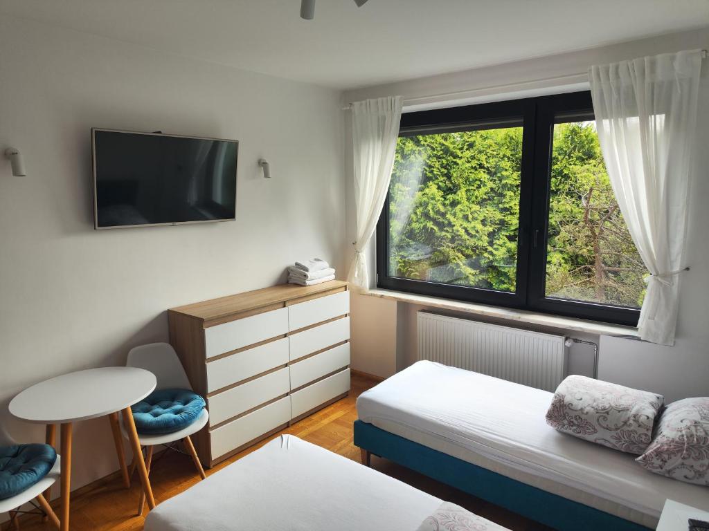 Postel nebo postele na pokoji v ubytování Apartamenty Monterska