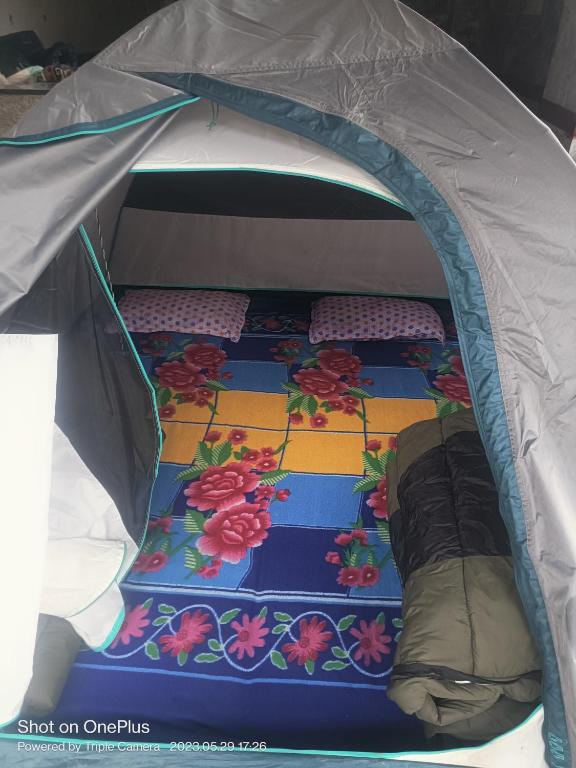 a small tent with two beds in it at GarhKumoan in Kedārnāth