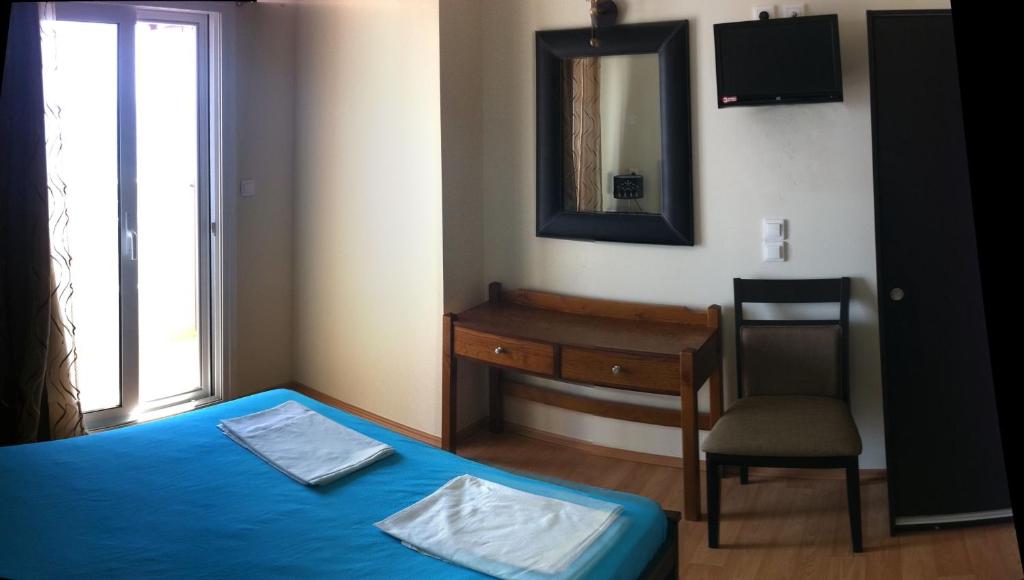 Postel nebo postele na pokoji v ubytování Ariadni Hotel Arvi by Estia