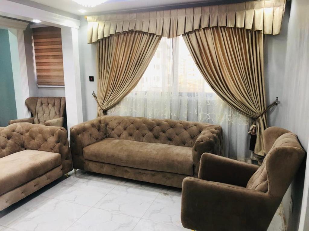 a living room with a couch and a window at CASA BONCUORE in Tema