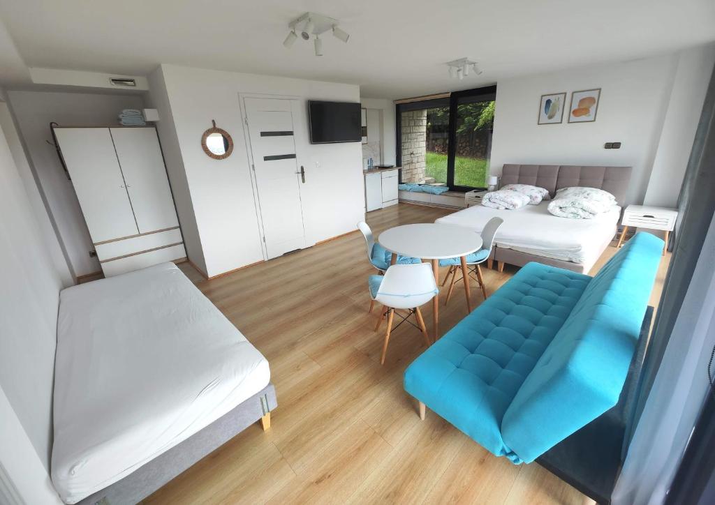 Postel nebo postele na pokoji v ubytování Apartamenty Monterska