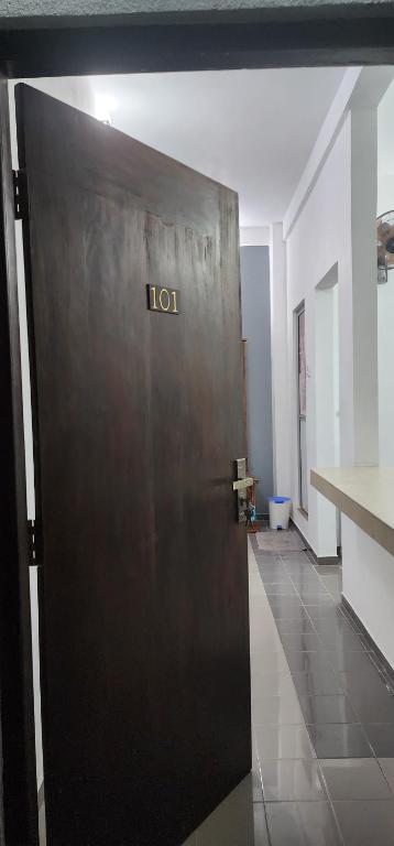 a metal door in a room with the wordolt on it at Andrews resident in Katunayake