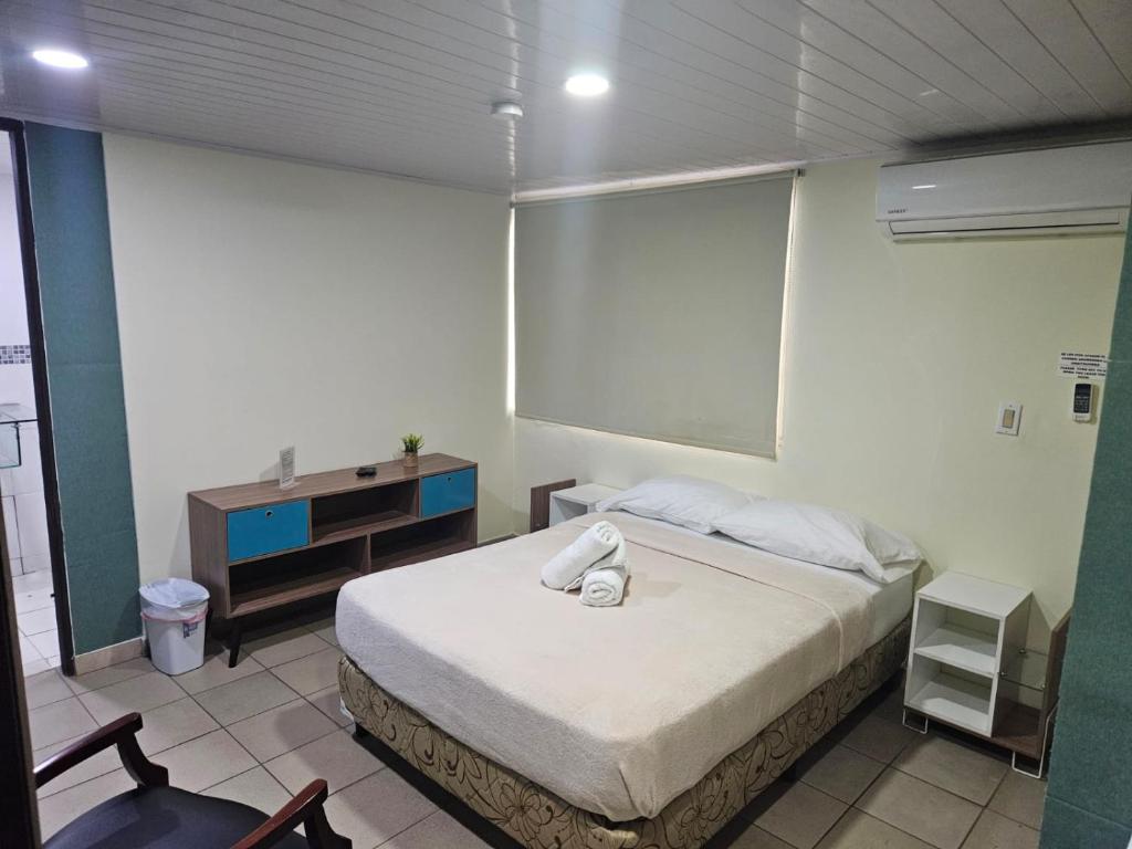 Voodi või voodid majutusasutuse Hostal EL Prado toas
