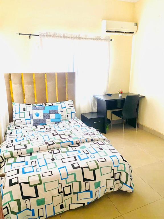 Postel nebo postele na pokoji v ubytování Miraph Apartment