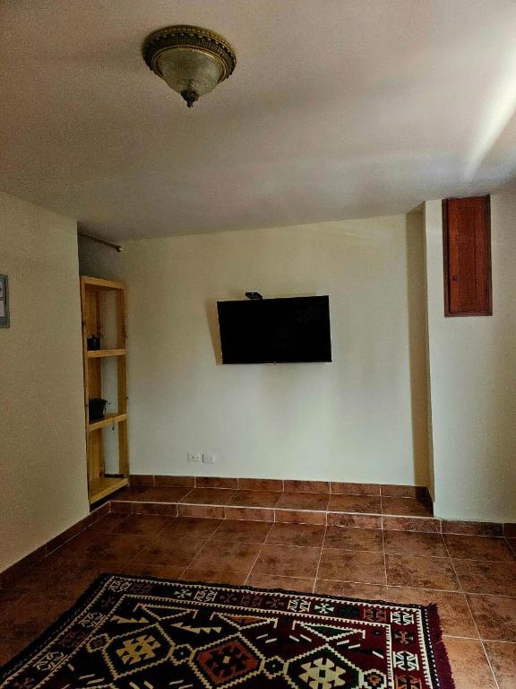 TV a/nebo společenská místnost v ubytování Bliss house cielo 92