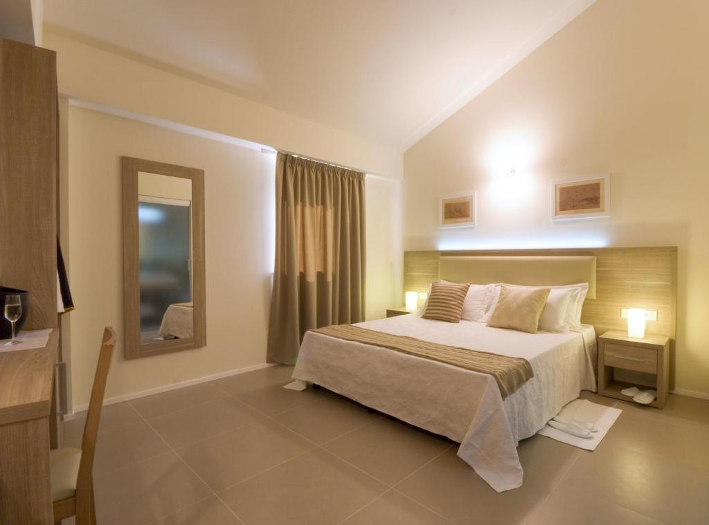Postel nebo postele na pokoji v ubytování Palazzo Ruschioni Boutique Hotel