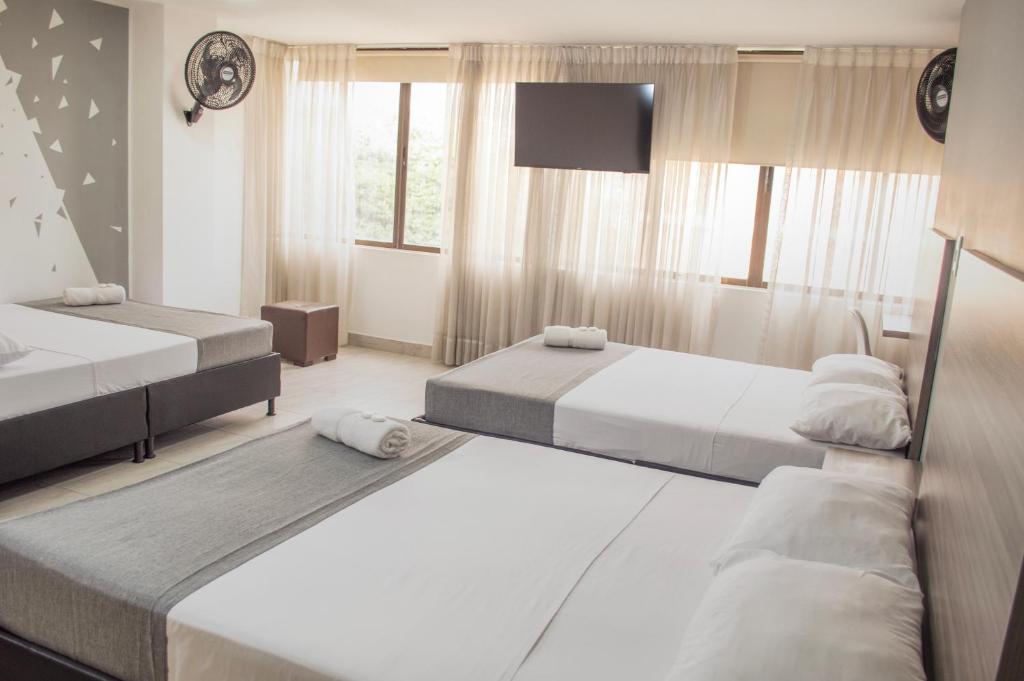 Postel nebo postele na pokoji v ubytování HOTEl INTER DEL CAFE