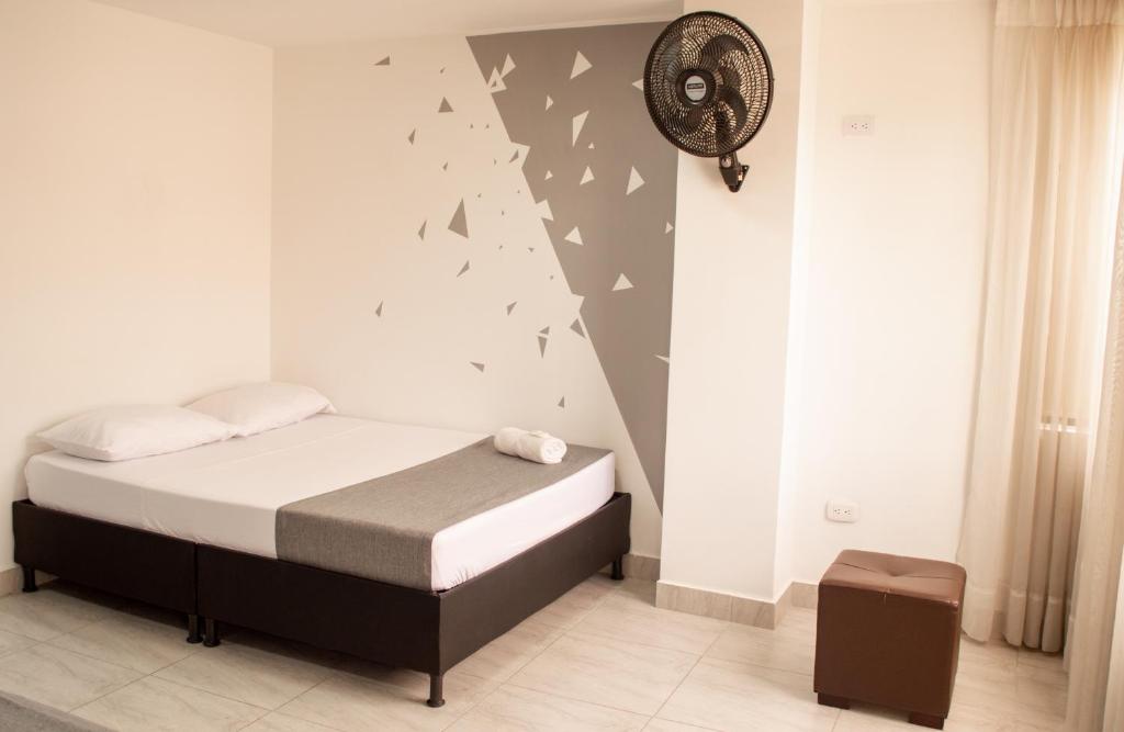 Postel nebo postele na pokoji v ubytování HOTEl INTER DEL CAFE