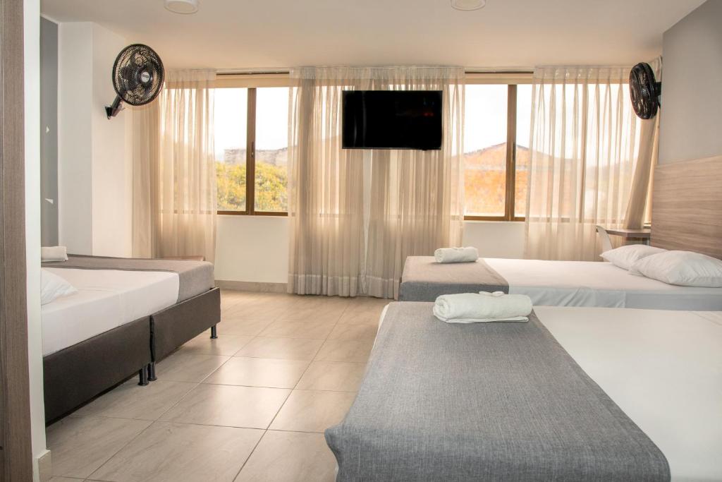 Postel nebo postele na pokoji v ubytování HOTEl INTER DEL CAFE
