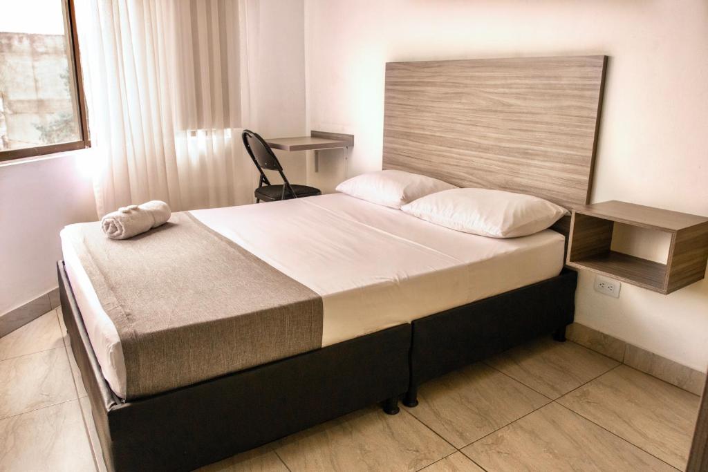 Postel nebo postele na pokoji v ubytování HOTEl INTER DEL CAFE