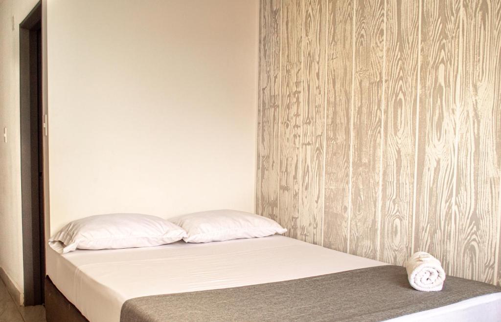 Postel nebo postele na pokoji v ubytování HOTEl INTER DEL CAFE