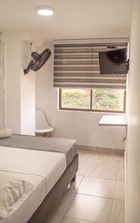 Postel nebo postele na pokoji v ubytování HOTEl INTER DEL CAFE