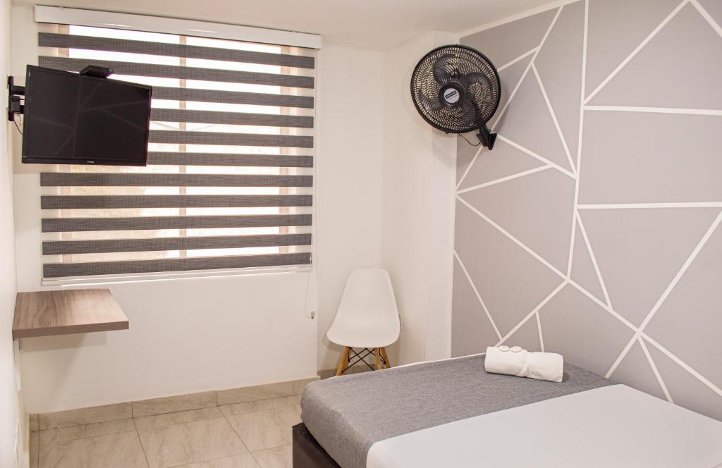 Postel nebo postele na pokoji v ubytování HOTEl INTER DEL CAFE
