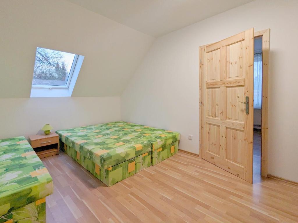 Posteľ alebo postele v izbe v ubytovaní Apartmány u Bernardů