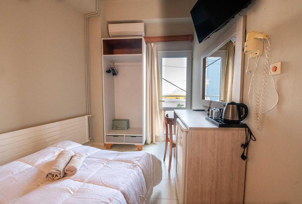 Posteľ alebo postele v izbe v ubytovaní Bikakis Family Apartments