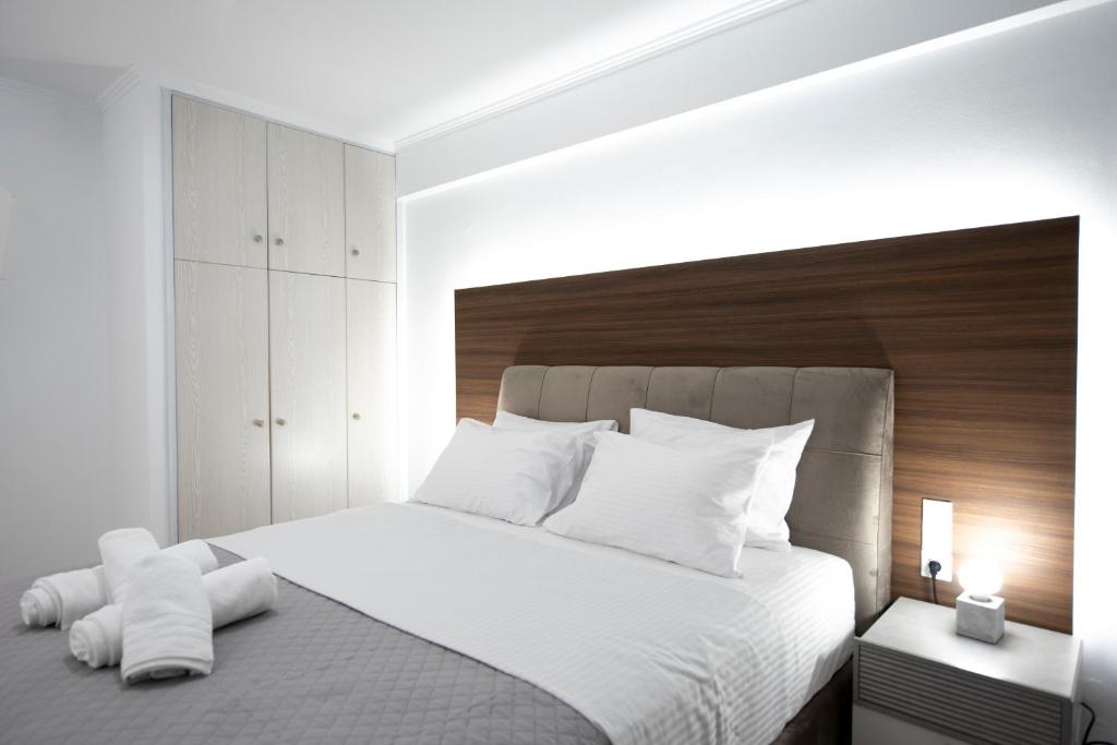Postel nebo postele na pokoji v ubytování MY PHOS Boutique Apartments