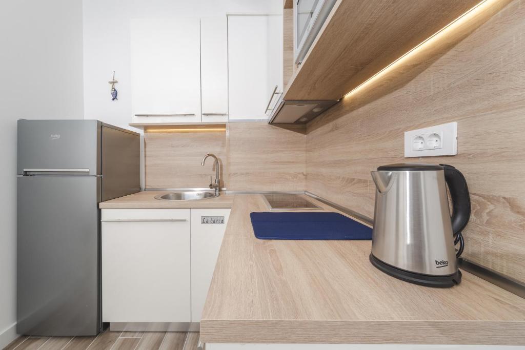 Kuchyň nebo kuchyňský kout v ubytování La barca apartments