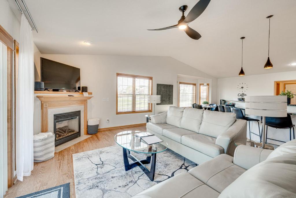 a living room with a couch and a fireplace at Luxury Prairie Retreat 5 Min from Madison! in Sun Prairie