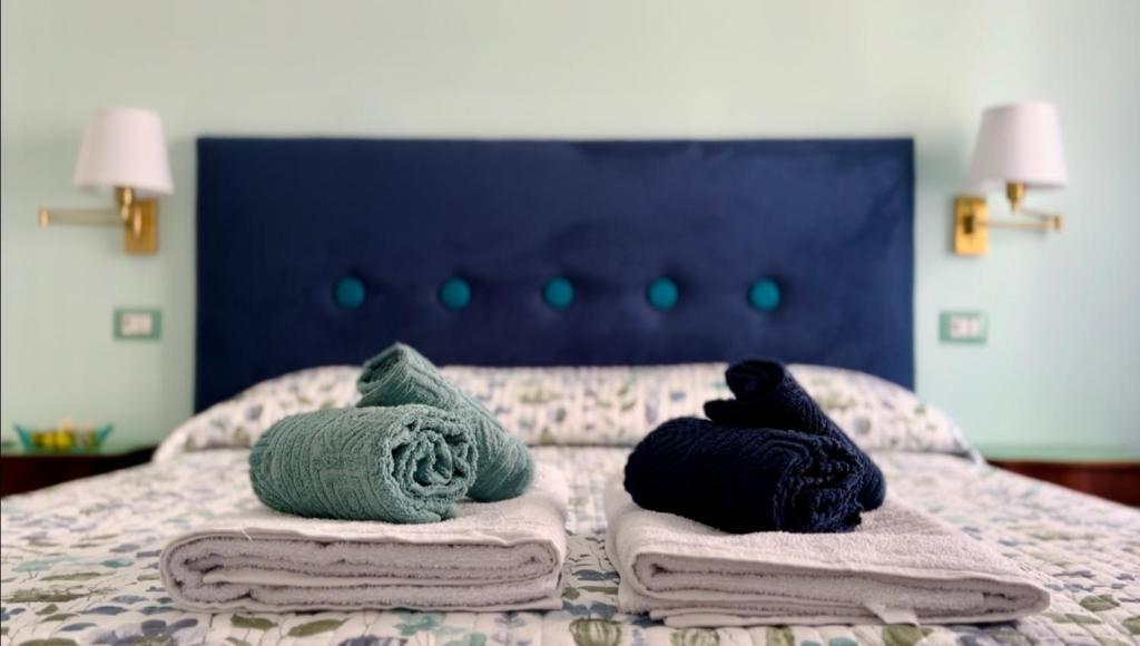 Postel nebo postele na pokoji v ubytování BlueMaGi