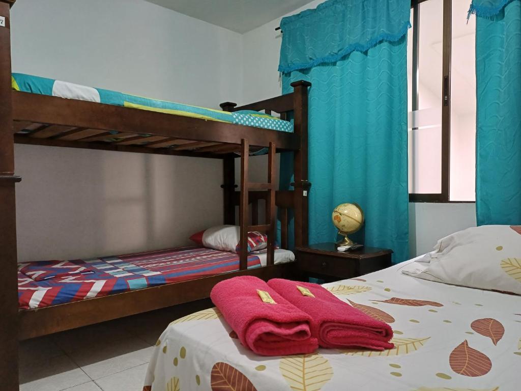Postel nebo postele na pokoji v ubytování Casablanca Hostel Cali B&B