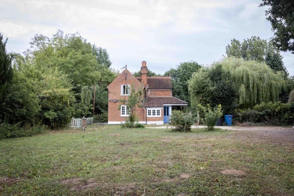 an old house with a yard in front of it at The Cottage, Marlow in Buckinghamshire