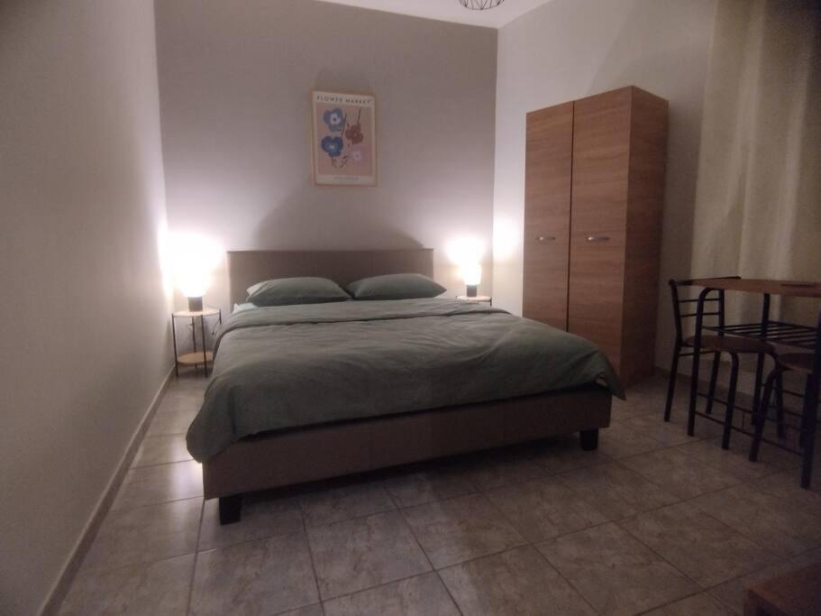 Ένα ή περισσότερα κρεβάτια σε δωμάτιο στο Marinos Central Suite
