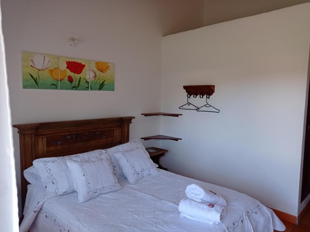 Postel nebo postele na pokoji v ubytování Casa Hotel La Villa del Rosario