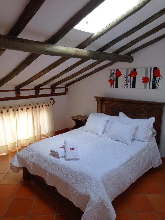 Postel nebo postele na pokoji v ubytování Casa Hotel La Villa del Rosario