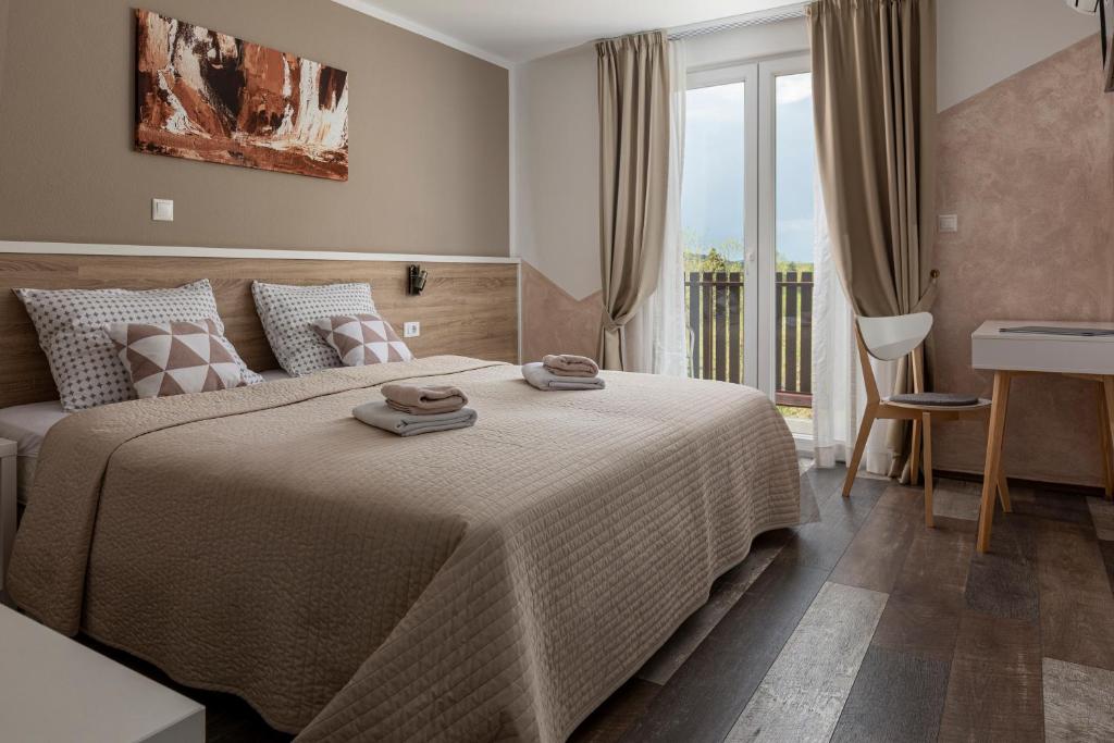 Posteľ alebo postele v izbe v ubytovaní Tourist Center Marko