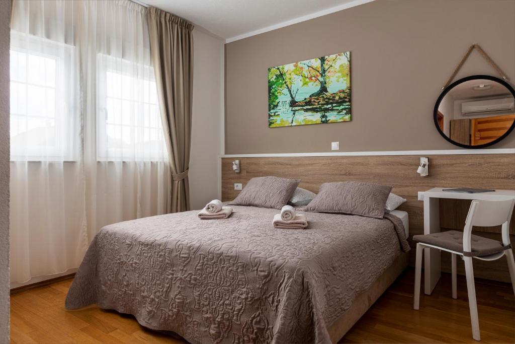 Posteľ alebo postele v izbe v ubytovaní Tourist Center Marko