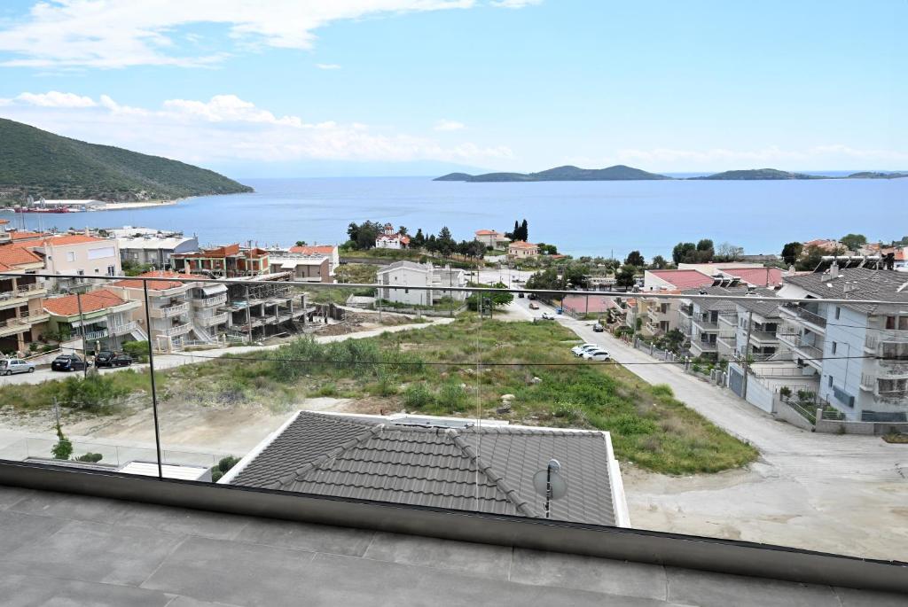 a view of a city and the water at ALTA MARE in Nea Peramos
