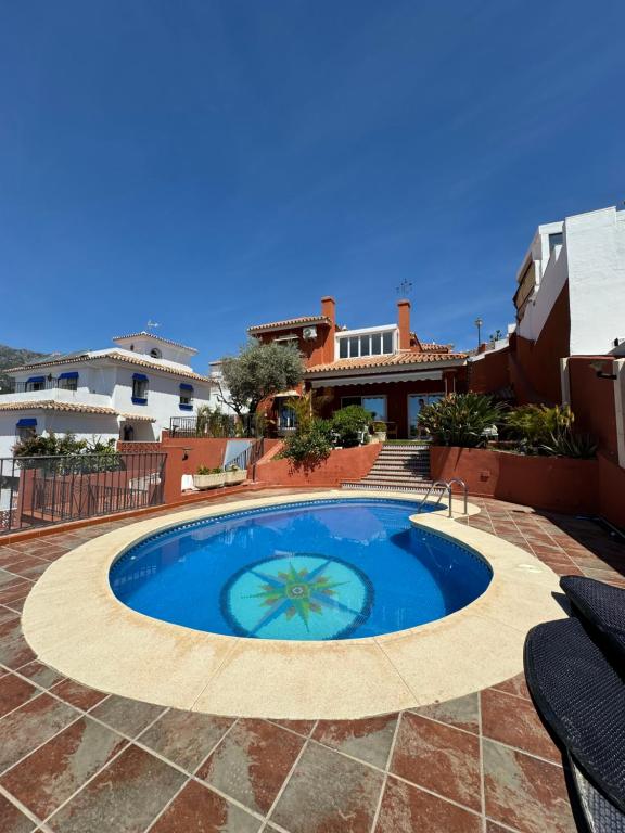 a swimming pool in the middle of a patio at Luxury villa in the heart of the city of Marbella Spain. in Marbella