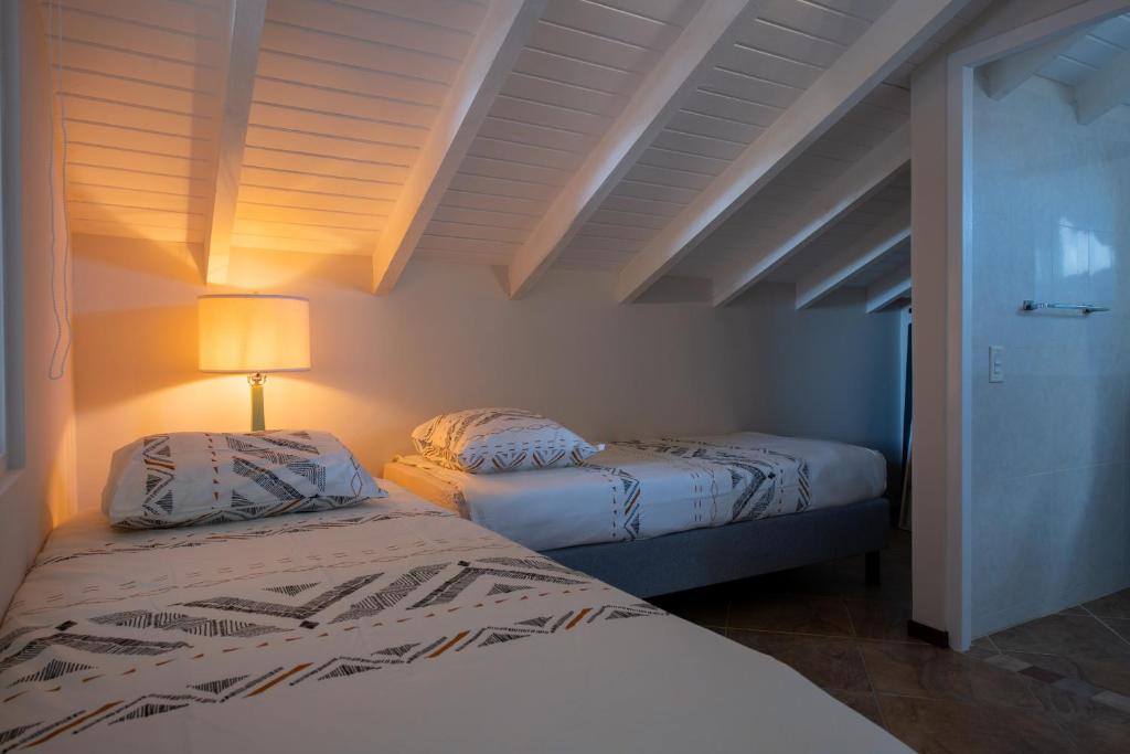 Postel nebo postele na pokoji v ubytování Masbango Beach Resort