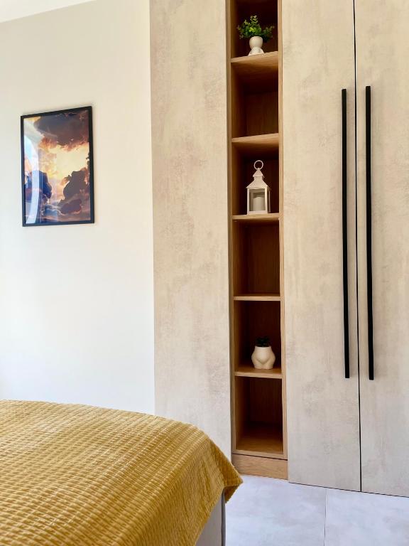 Letto o letti in una camera di Apartament HORYZONT z widokiem na Jezioro Drwęckie