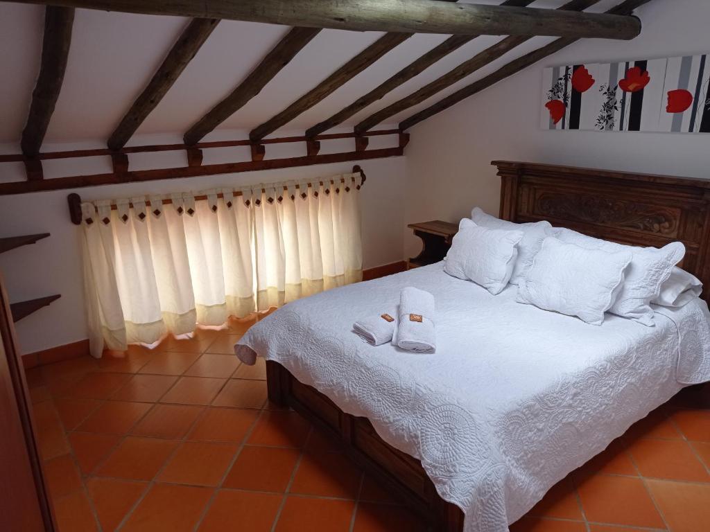 Postel nebo postele na pokoji v ubytování Casa Hotel La Villa del Rosario