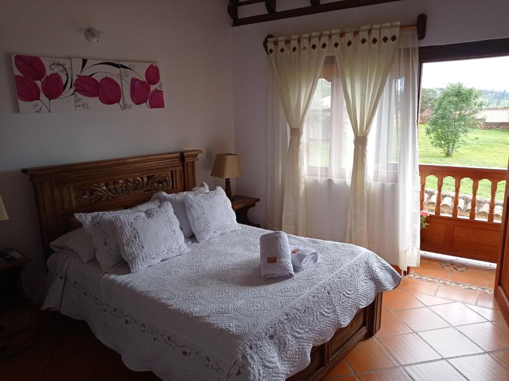 Postel nebo postele na pokoji v ubytování Casa Hotel La Villa del Rosario