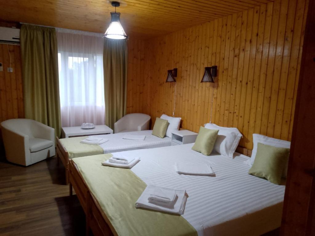 Postel nebo postele na pokoji v ubytování Pensiunea Solinia