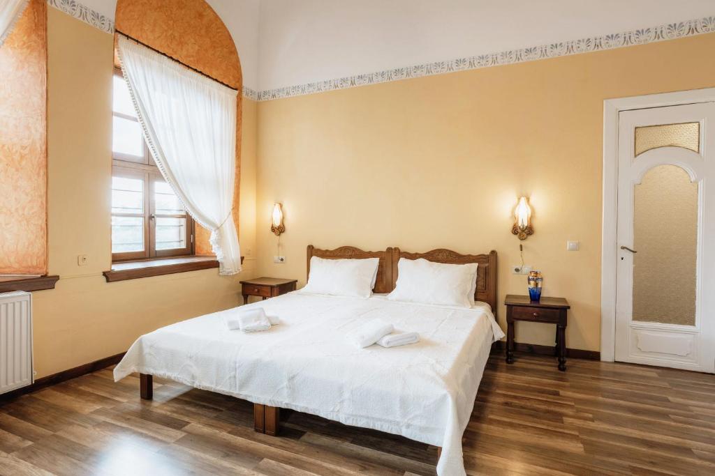 Postel nebo postele na pokoji v ubytování Archontiko Kantartzi
