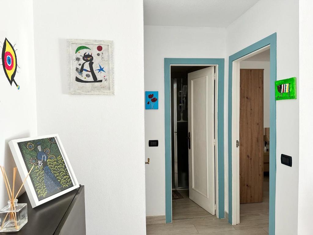 a hallway with an open door and a room with a door at Relaxing Ocean View, Spacious Art Apartment With Large Terrace, Near Best Costa Adeje Beaches in Adeje