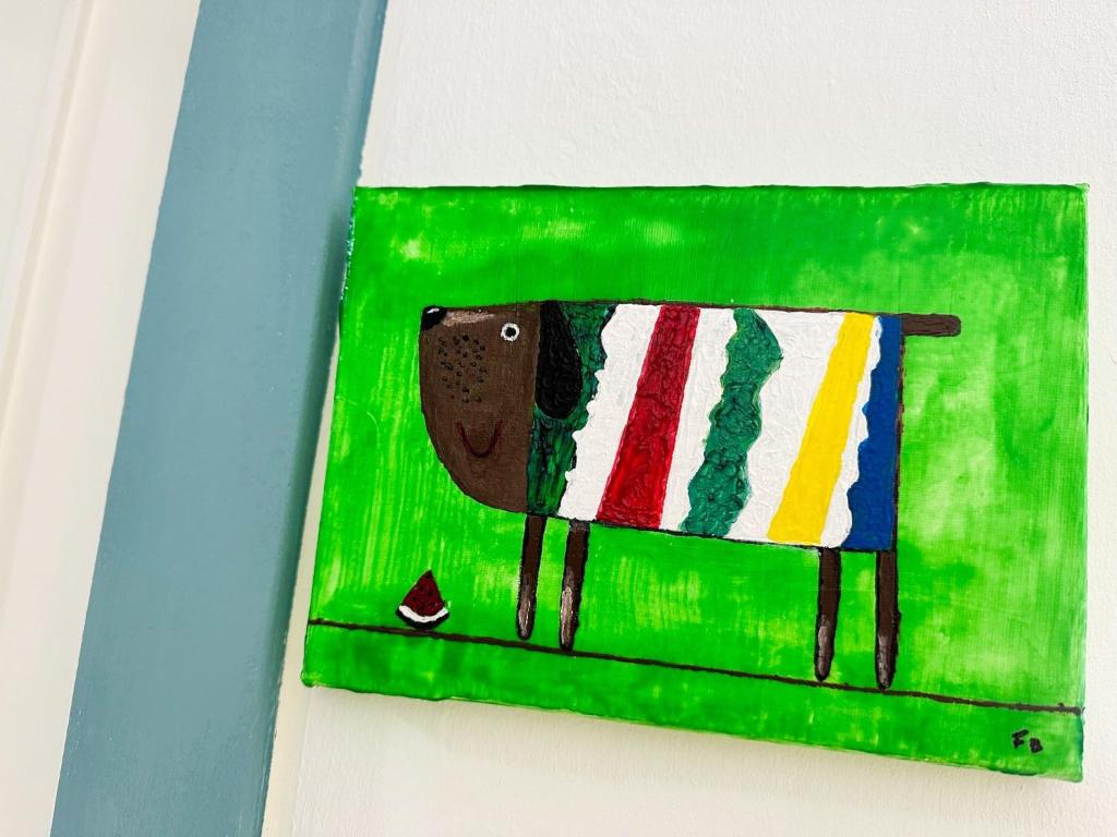 a painting of a cow on a wall at Relaxing Ocean View, Spacious Art Apartment With Large Terrace, Near Best Costa Adeje Beaches in Adeje