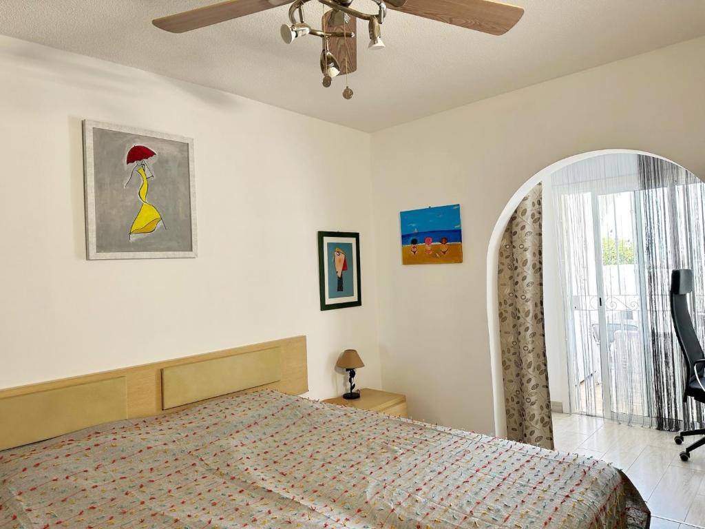 a bedroom with a bed and a window at Relaxing Ocean View, Spacious Art Apartment With Large Terrace, Near Best Costa Adeje Beaches in Adeje
