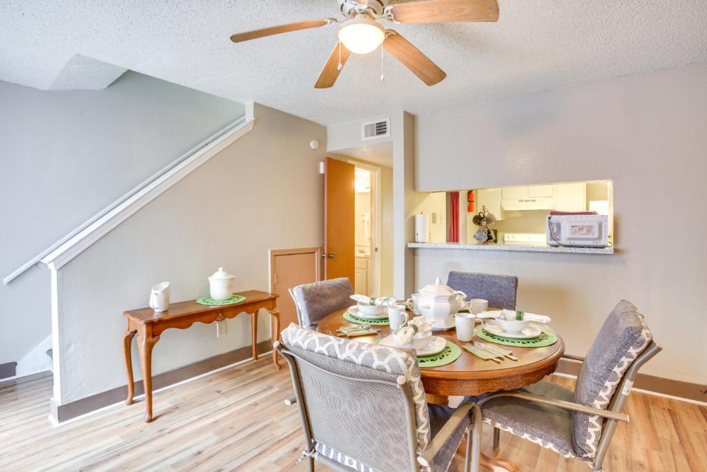 a dining room with a table and chairs and a ceiling fan at Convenient Harvey Apt - 12 Mi to French Quarter! in Harvey