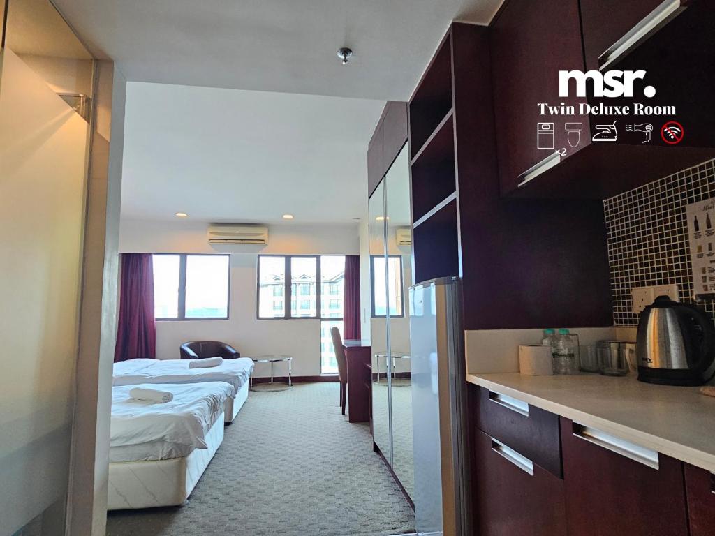 Kuchyň nebo kuchyňský kout v ubytování Kota Kinabalu City Ensuite at SCSP Ming Garden