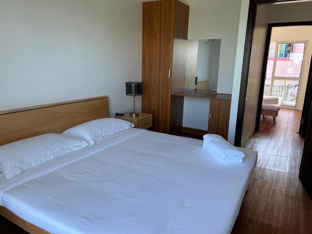 Postel nebo postele na pokoji v ubytování Easy Apt
