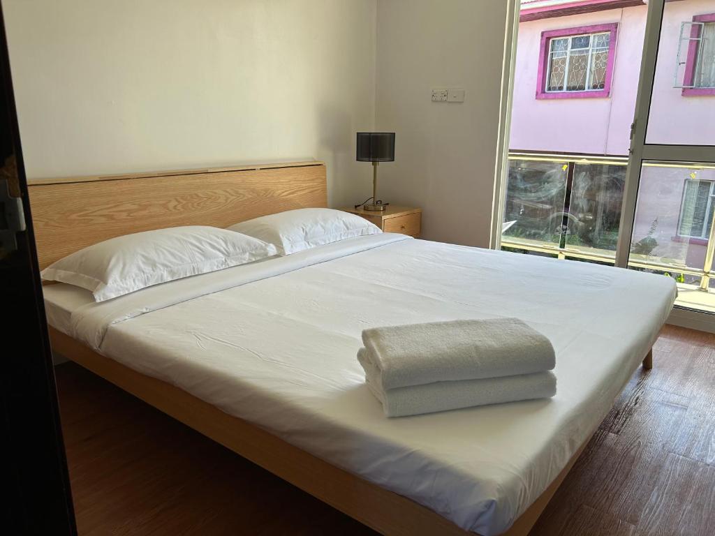 Postel nebo postele na pokoji v ubytování Easy Apt