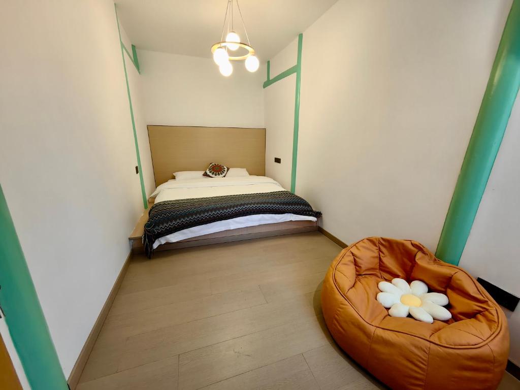 Postel nebo postele na pokoji v ubytování 小喜屋（美周路店）