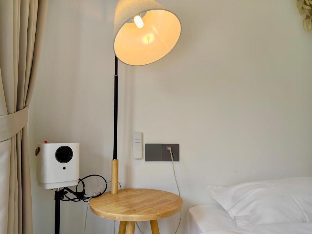 Postel nebo postele na pokoji v ubytování 小喜屋（美周路店）