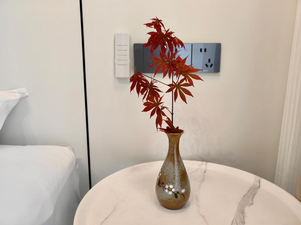 Postel nebo postele na pokoji v ubytování 小喜屋（美周路店）